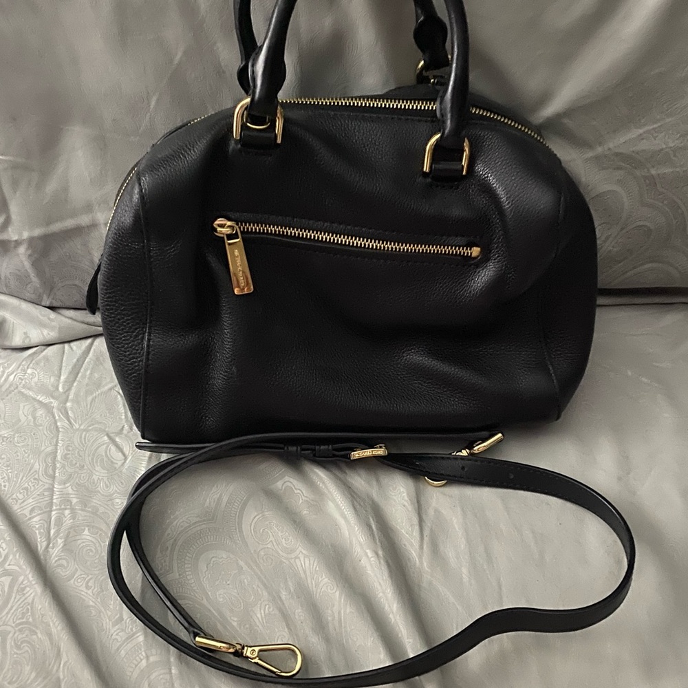 I’m selling my black MK satchel handbag.